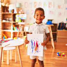 kid holding a painting