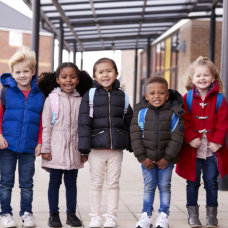 kids standing and smiling