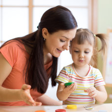 woman assisting a child