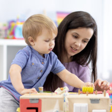 woman assisting a child