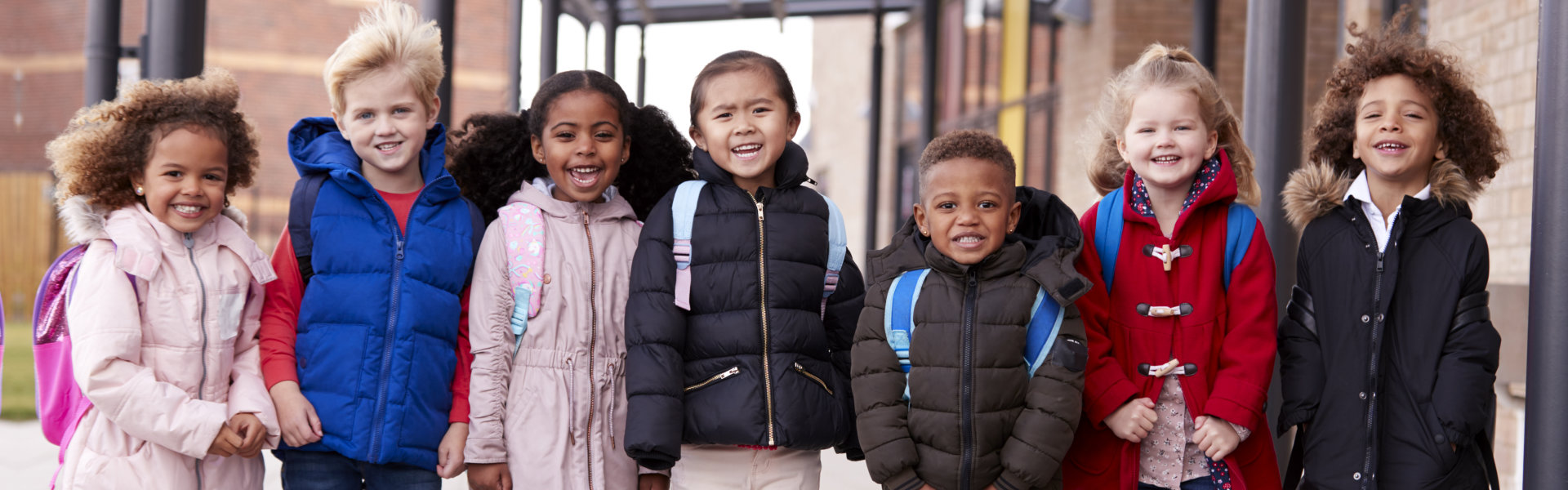 kids standing and smiling