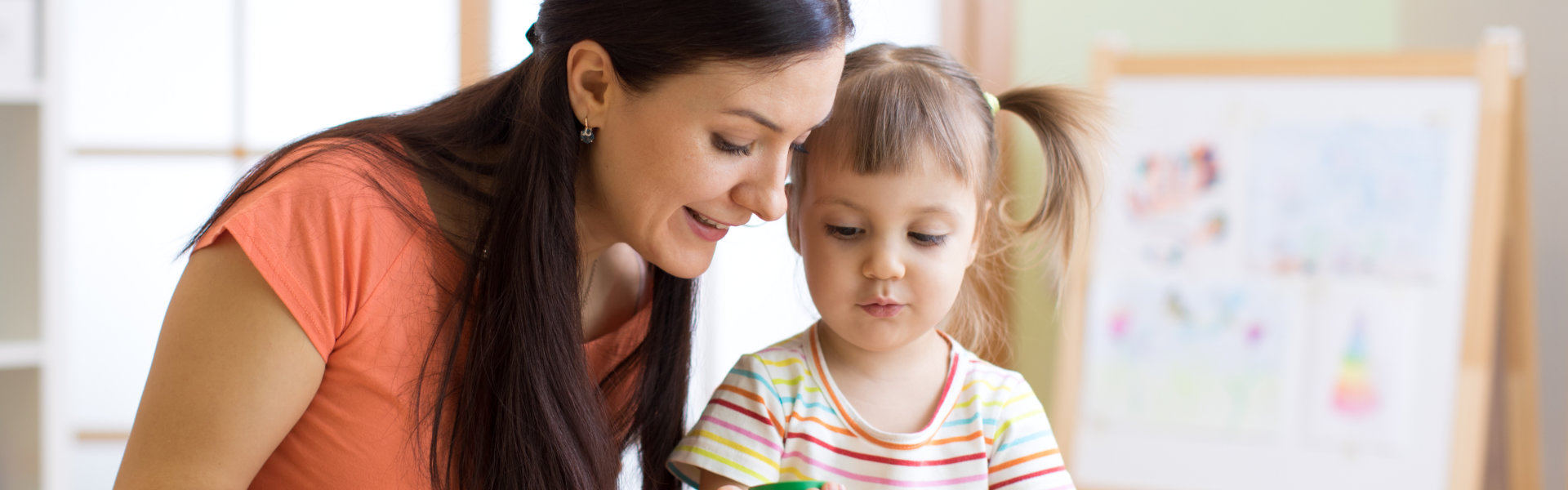 woman assisting a child